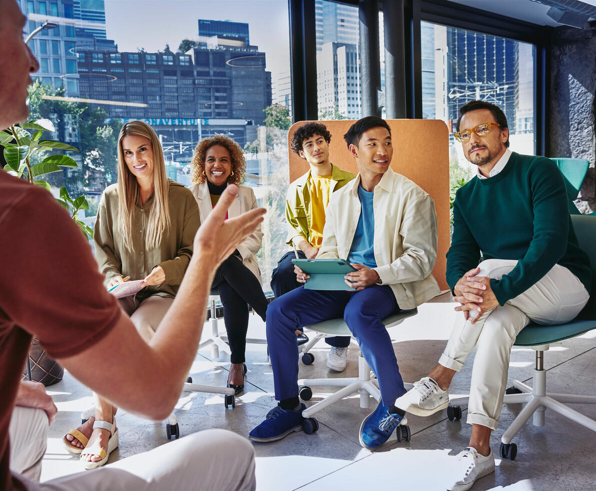 people working in an office boardroom